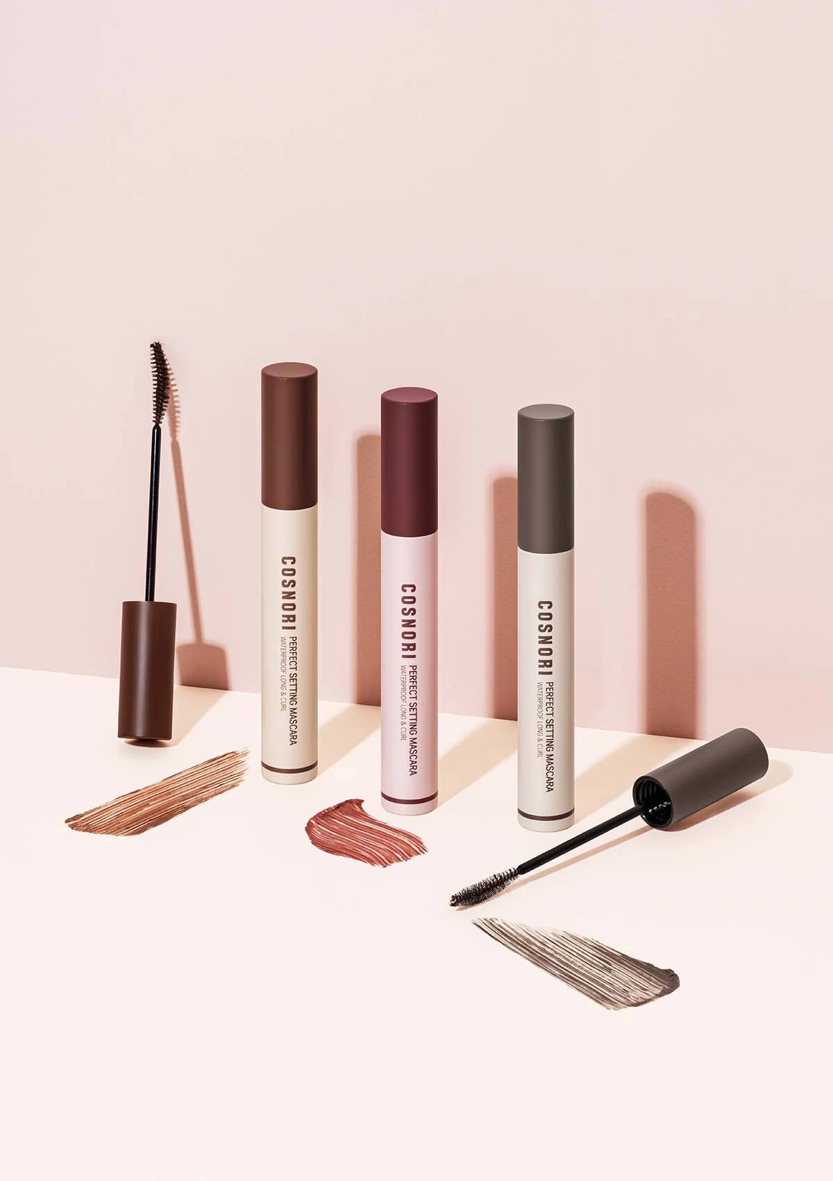 Cosmetik makeup products on a light pink background